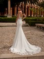 Bride wearing crepe mermaid wedding dress with lace cut out chapel train