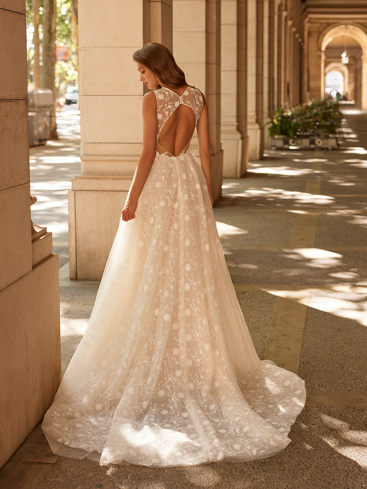 Pronovias - This open-back design jazzes up an otherwise simple gown. We  adore Valeria style! --- http://goo.gl/aHE2bN --- | Facebook