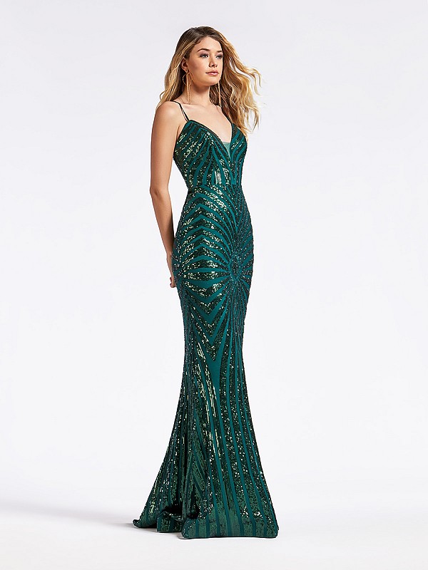 Long green formal gown with illusion inset on deep sweetheart neckline and sparkly sequins
