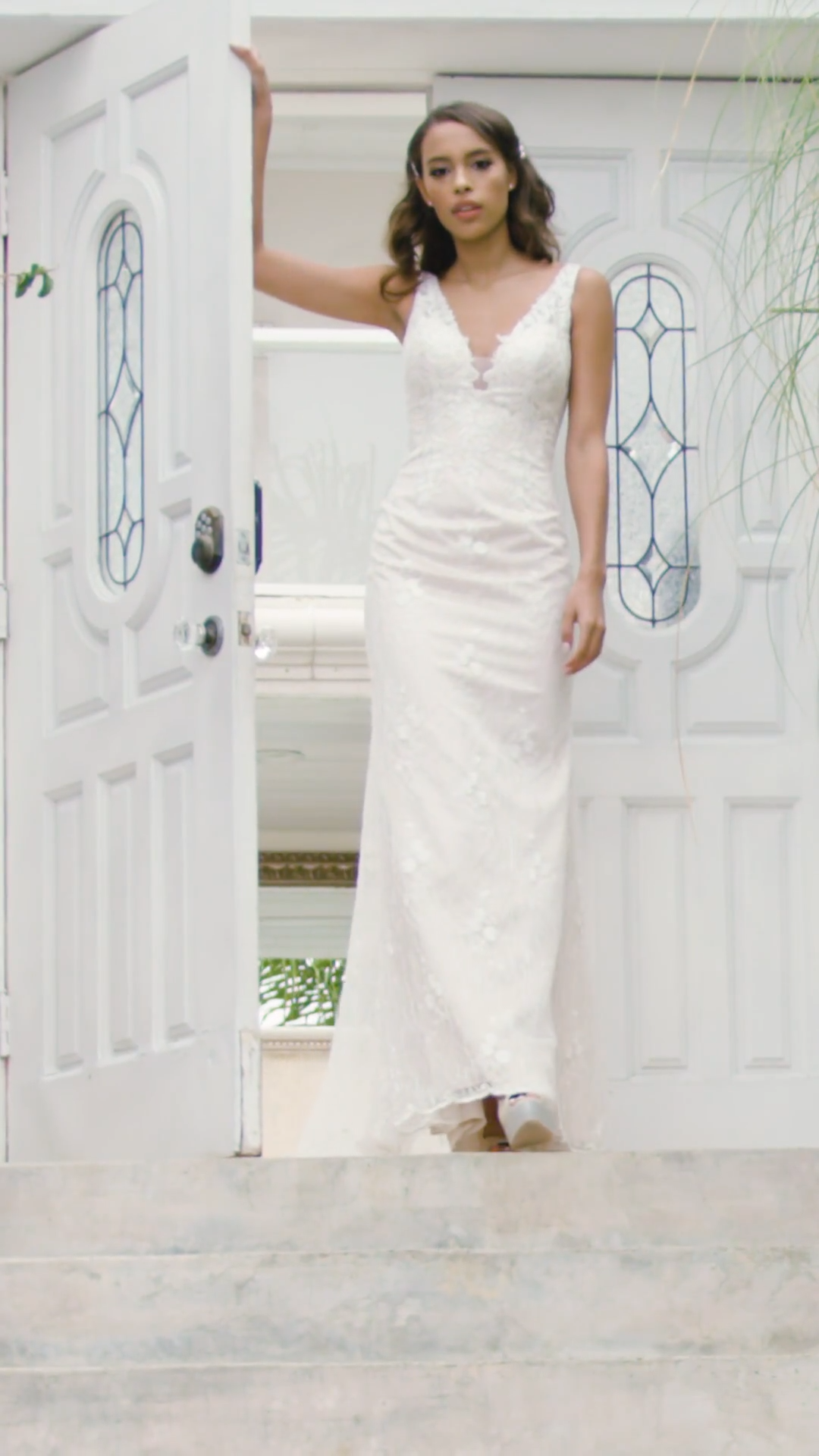Style ALISO deep V-neck and illusion V-back mermaid bridal gown in all over lace with beaded lace accents Style ALISO deep V-neck and illusion V-back mermaid bridal gown in all over lace with beaded lace accents