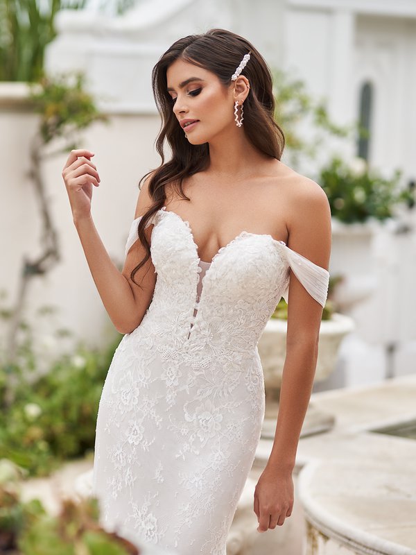 Style BALBOA deep sweetheart with illusion inset front bodice with tulle swag sleeves lace appliques over Chantilly lace gown