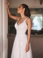 Style DELMAR deep V-neck A-line gown with floral beaded lace bodice and vertical lace along the skirt