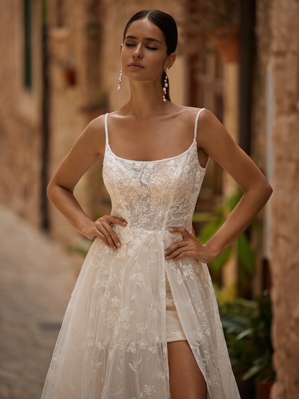 Closeup View of Lace Wedding Dress With Scoop Neckline and Mini Skirt