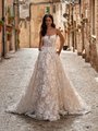 Bohemian floral lace A-line wedding dress with scoop neckline and pockets in the skirt